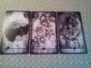 Six of Cups, Four of Pentacles, Nine of Pentacles, from the Darkana Tarot